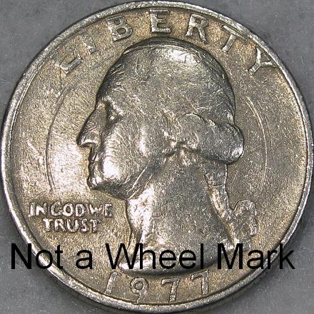DM Rare Coins photography service demonstrates a wheel mark versus a rolling machine scratch on Washington quarters and Franklin half dollars. 