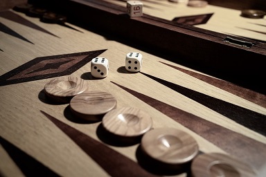 Backgammon table of late 18th Century shows wooden medals or gaming peices with portraits.